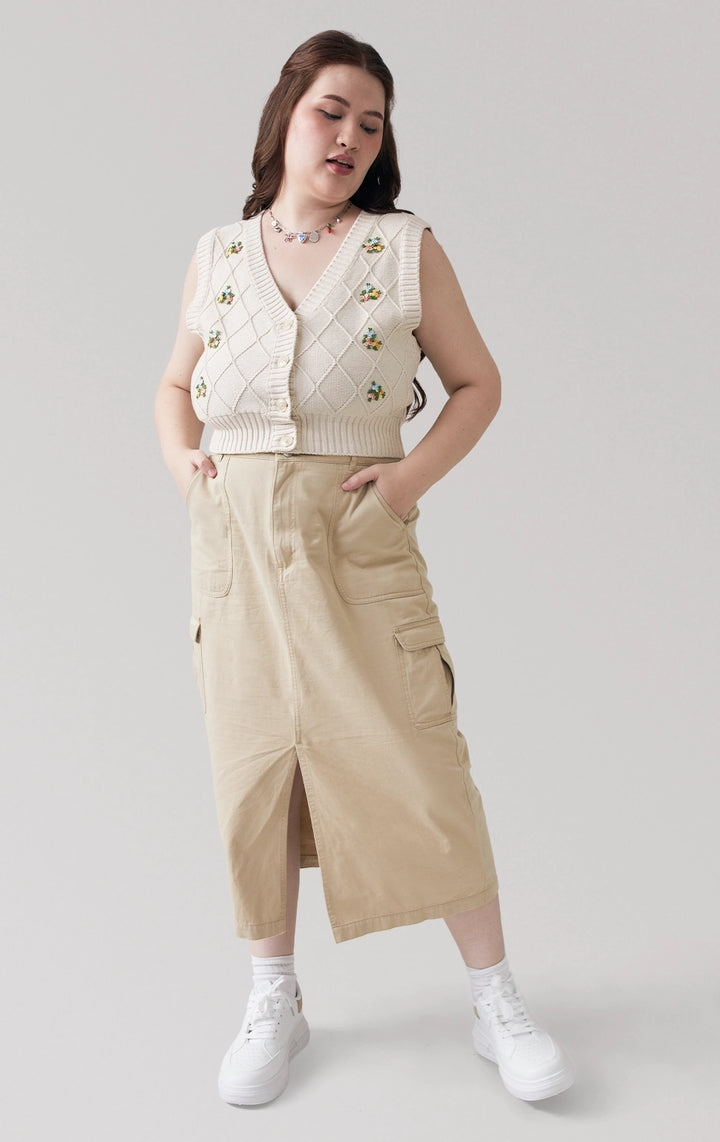 Full front view of the Trellis Cable Knit Button Front Cropped Vest in beige, showing its V-neckline and cable knit texture with floral embroidery from Just G Philippines.