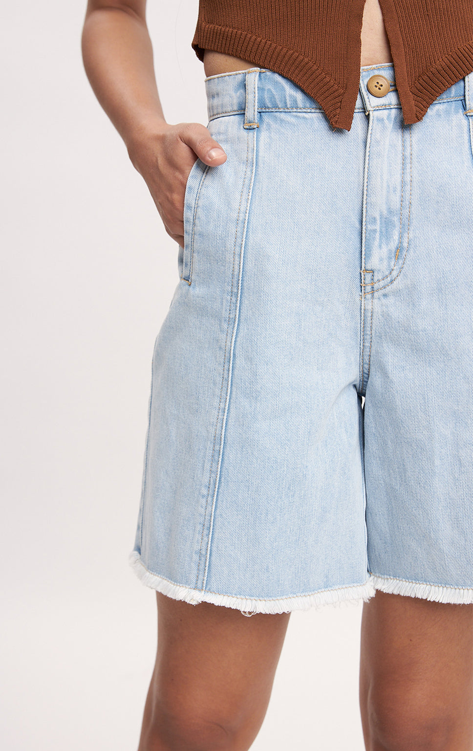 HIGH WAISTED DENIM JORTS WITH CUT AND SEW DETAIL