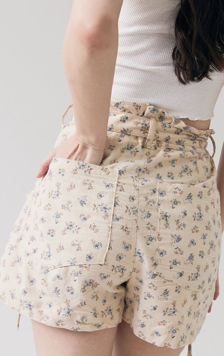 Close-up of back details of the Floral Print Peached Canvas Paperbag Shorts, showing peached canvas texture and soft pleats from Just G Philippines.