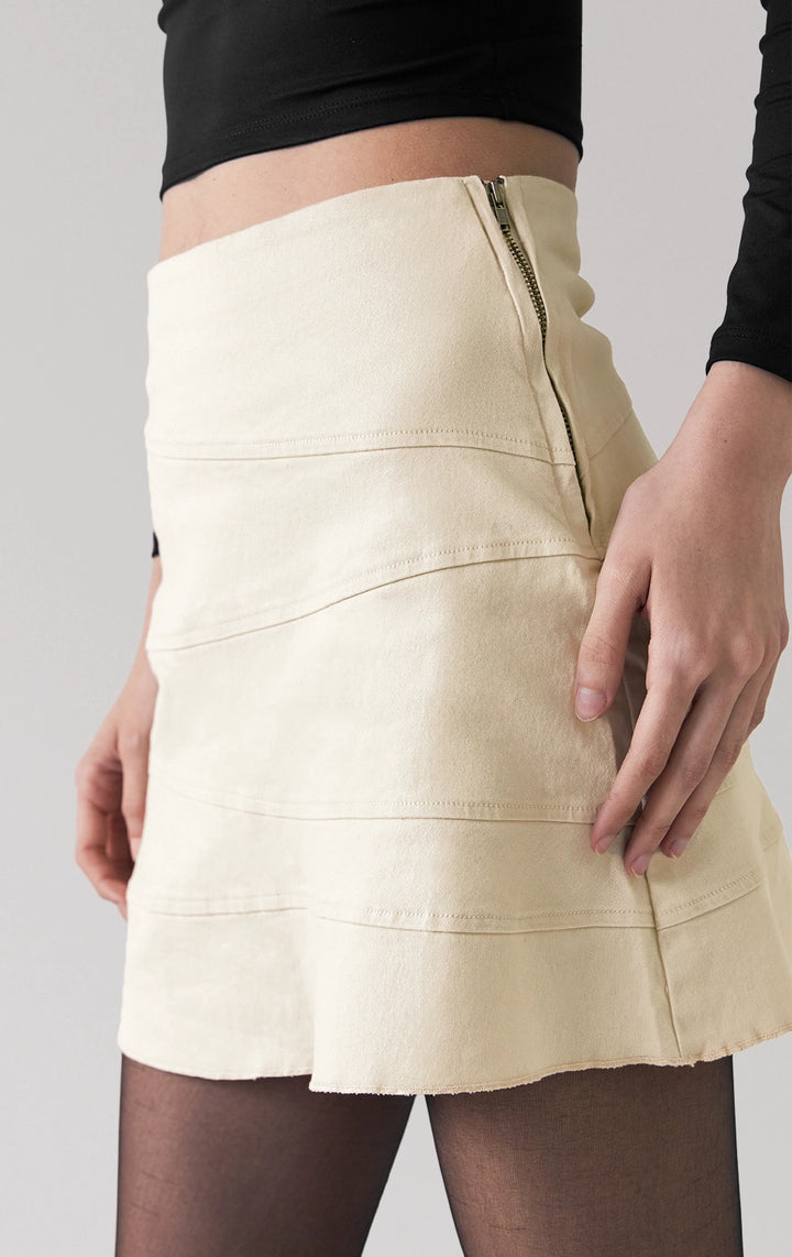Front detail close-up of the stitching and panel design on the cut and sew short skirt by Just G Philippines