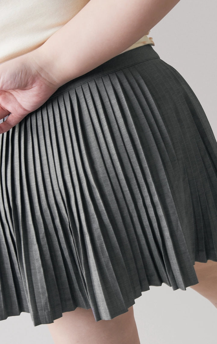 Back detail close-up of the pleats and stitching on the mini skirt by Just G Philippines
