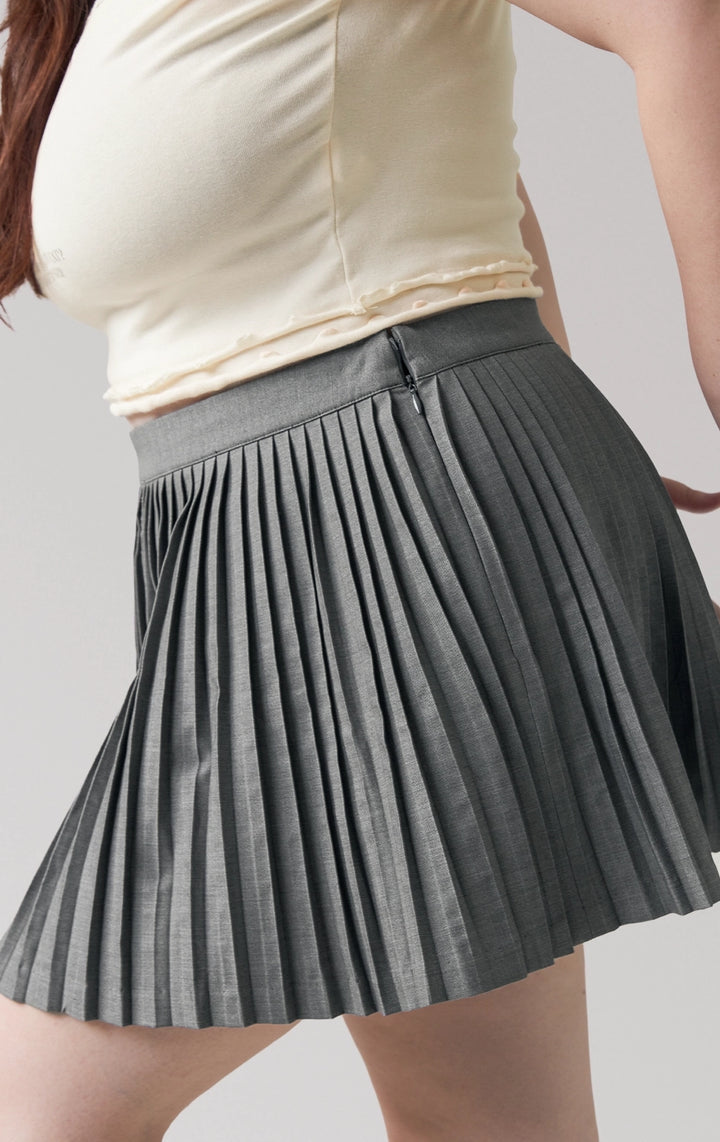 Front detail close-up of the pleated details and texture on the mini skirt by Just G Philippines