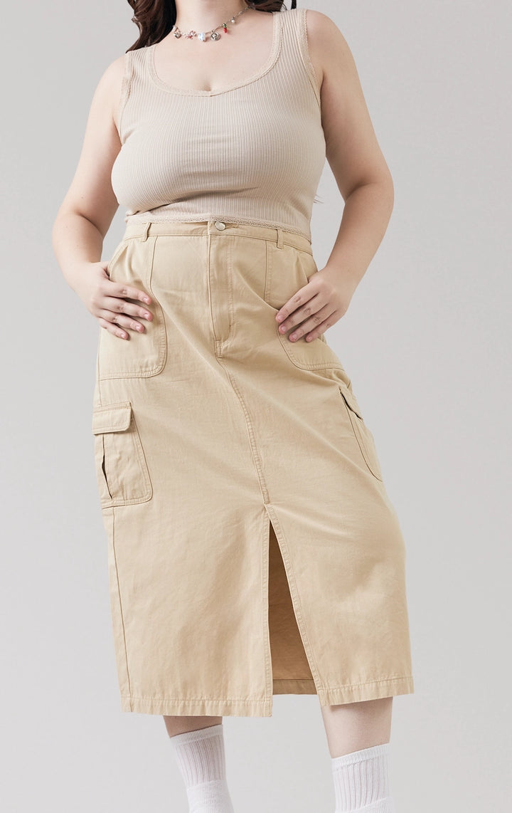 Stylized image of model wearing the brown Mid Waist Cargo Midi Skirt with Front Slit, styled with a laidback top for a cool city stroll look from Just G Philippines.