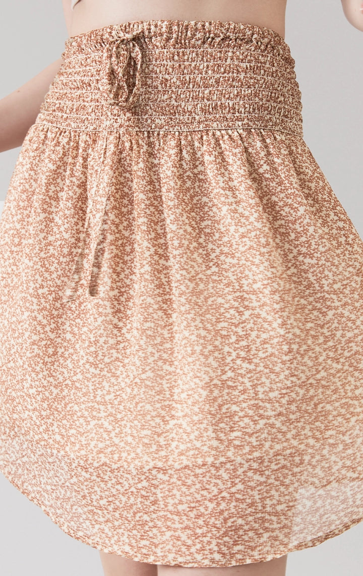 Stylized photo of model in High-Waist Drawstring Smocked Waist Chiffon Long Skirt styled for brunch or cafe hopping in the Back to School collection from Just G Philippines.