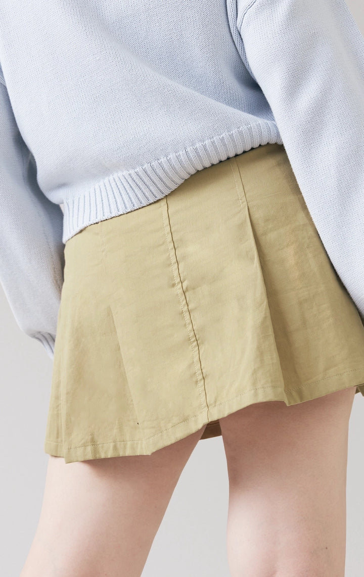 Close-up of back details of the Belted Pleated Mid Waist Skort in green, showing twill texture and subtle pleating from Just G Philippines.