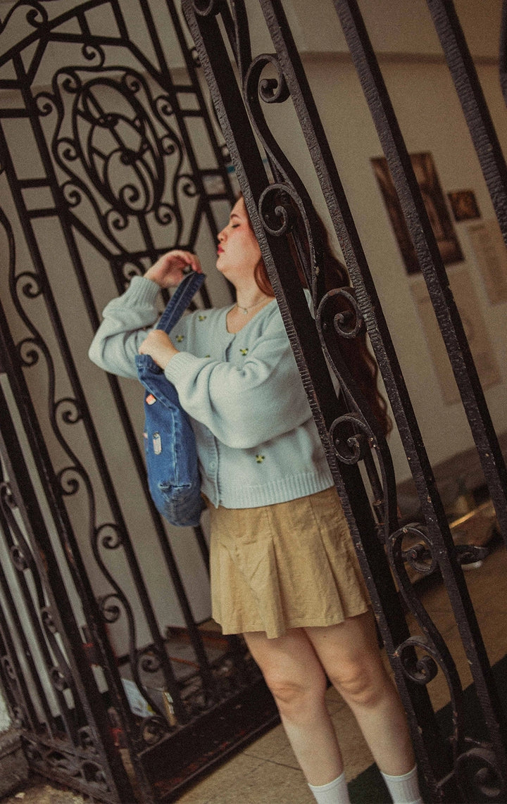Campaign photo of woman wearing Belted Pleated Mid Waist Skort in green from Gen Z and young adult women's brand Just G Philippines.