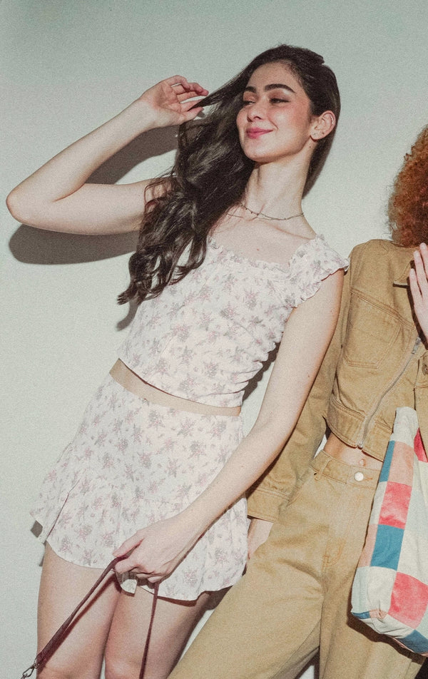 Campaign photo of a woman wearing the Floral Milkmaid Top With Lace And Ruffled Skort Set from the Back to School collection by Just G Philippines.
