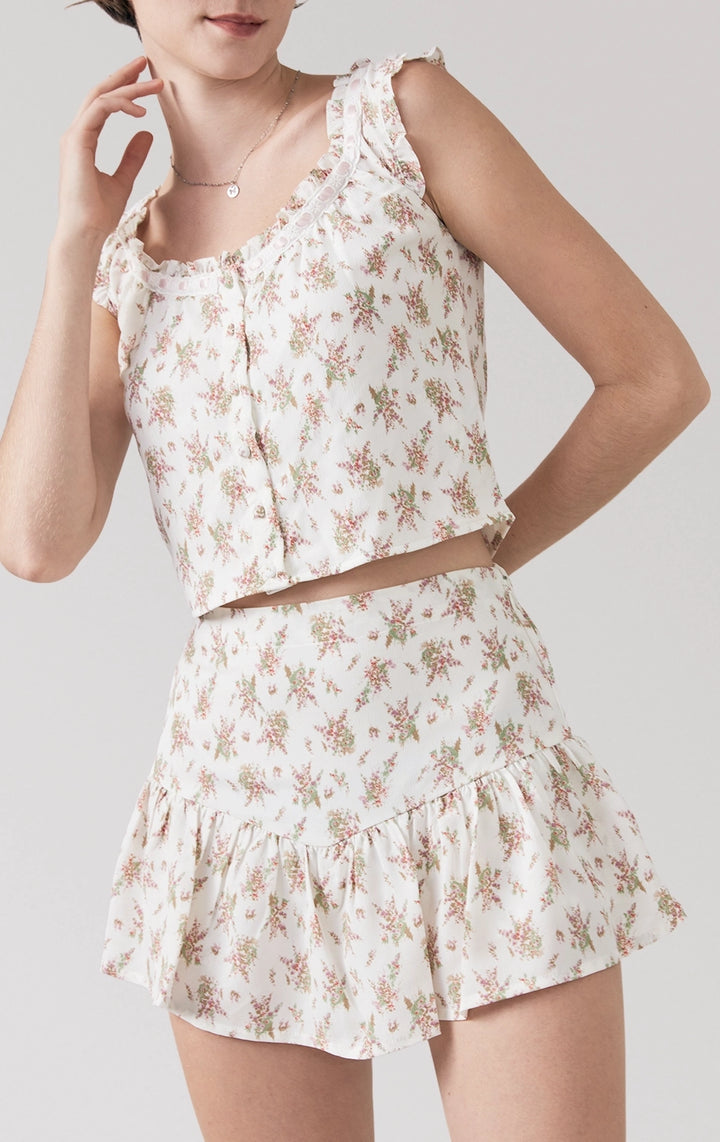 Stylized photo of Floral Milkmaid Top with Lace and Ruffled Skort Set from Just G Philippines' Back to School collection, styled with a breezy floral look.