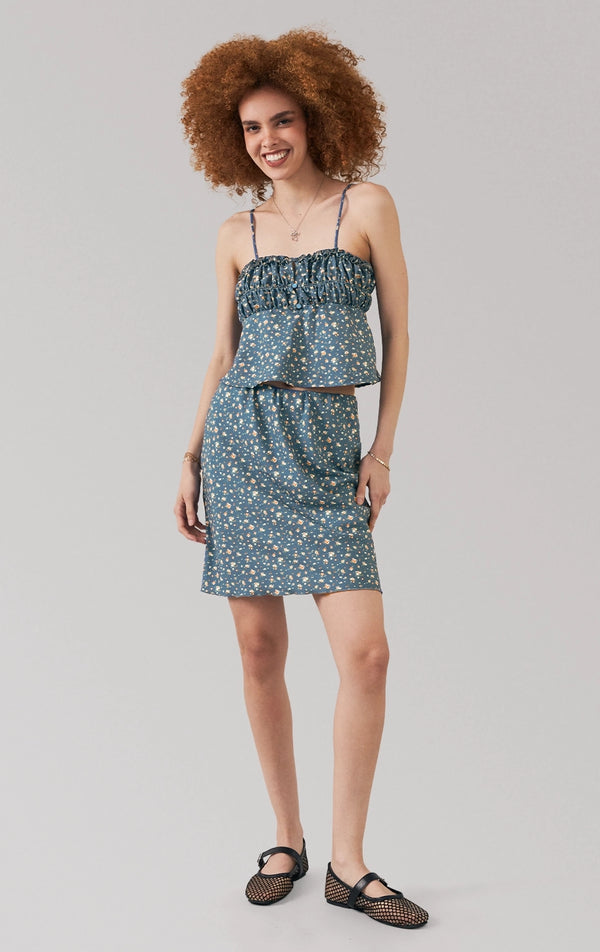Full front view of a model wearing the ditsy floral set showing the top and matching skirt by Just G Philippines