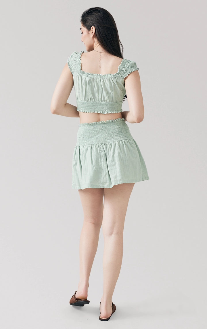 Full back view of woman in Textured Dobby Romantic Smocked Top and Skirt Set in sage green, featuring the smocked back fit and breezy finish. From Just G Philippines.