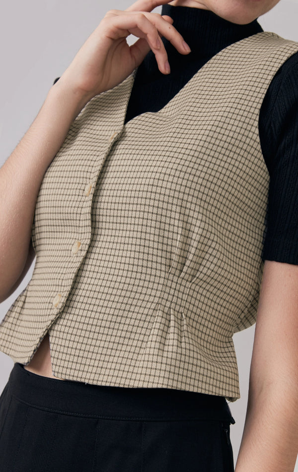 Front detail close-up of the houndstooth fabric texture and buttons on the vest by Just G Philippines