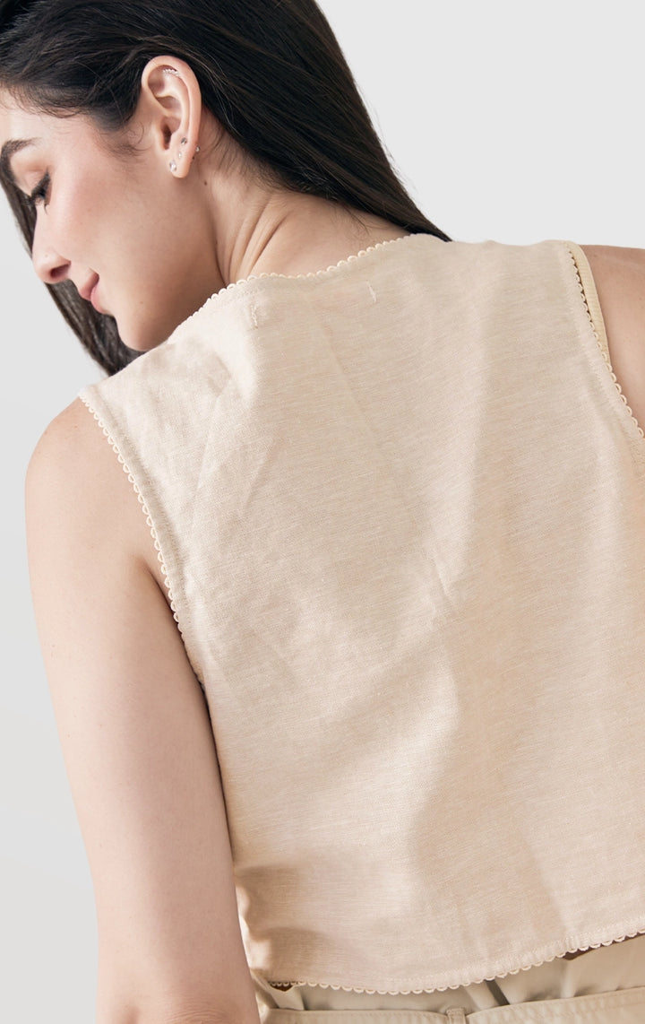 Close-up of back details of Cropped Linen-Like Tie Front Vest with Cross-Stitch Details and Lace, showing embroidery on cotton-linen fabric from Just G Philippines.